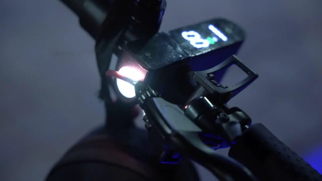 Cool flashlight mounted on an electric scooter at night