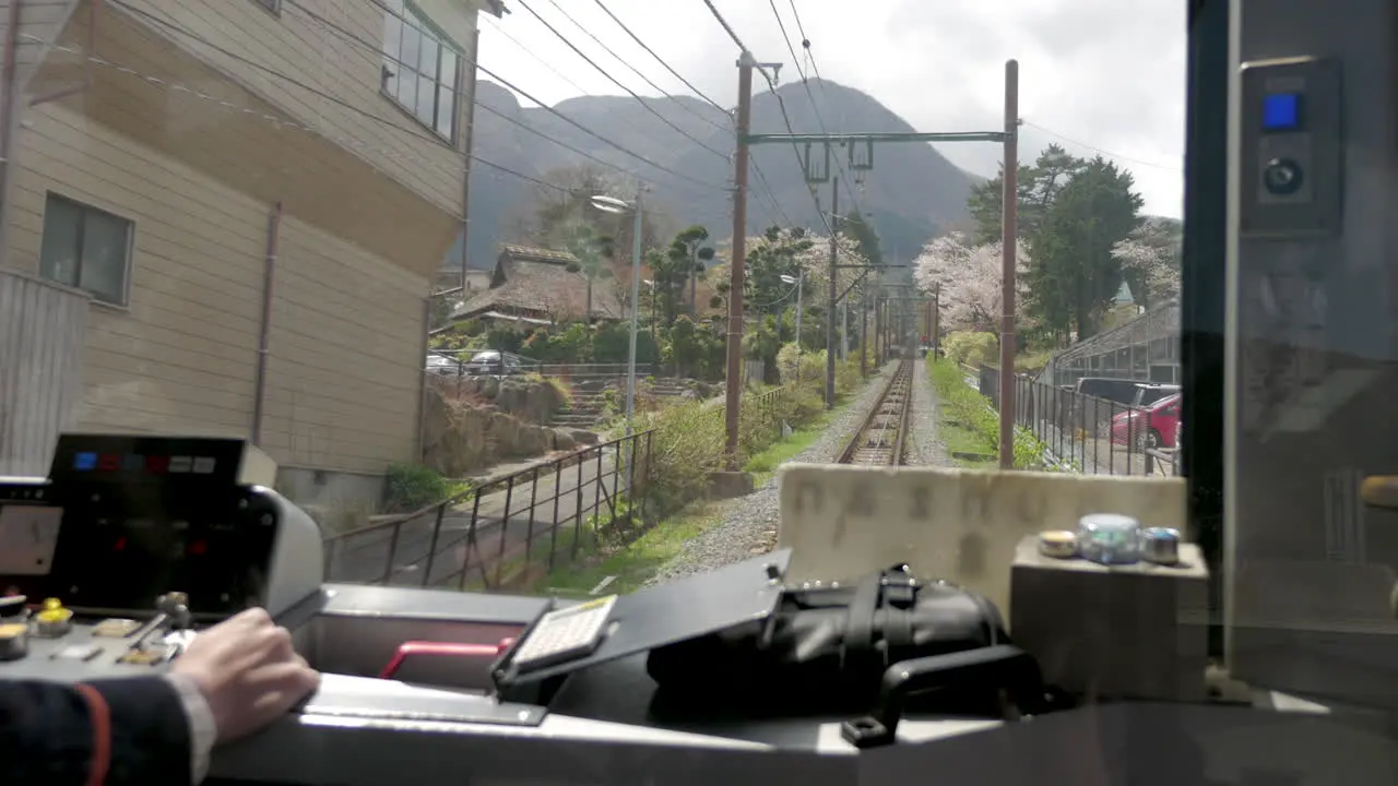 View of the pilot in a small mountain train in japan