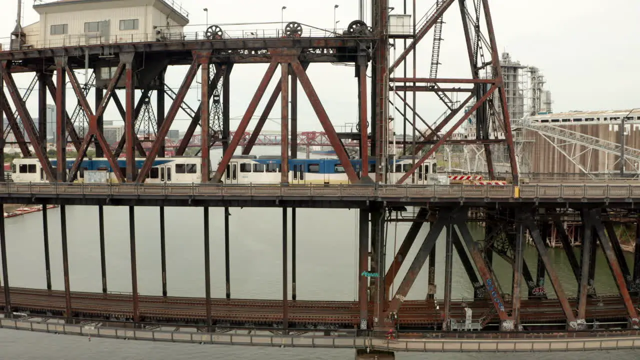 Profile aerial shot of a Max tram over Steel Bridge Portland Oregon