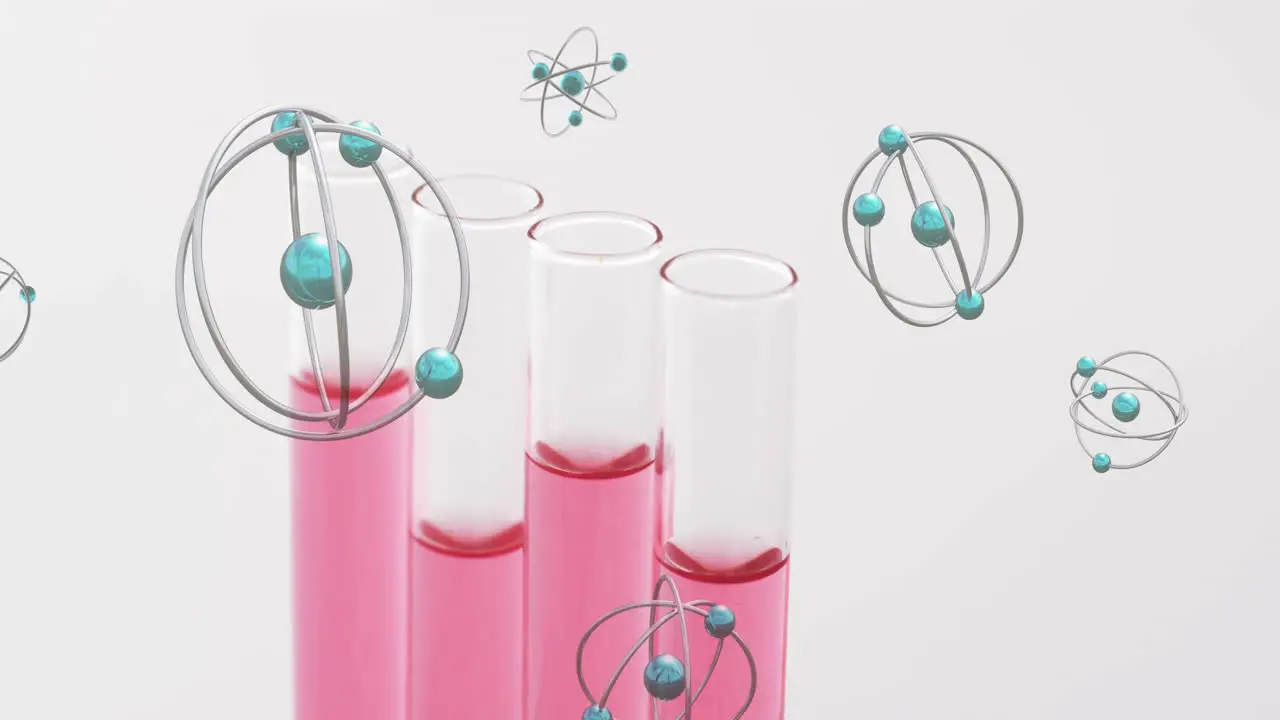 Animation of atoms over laboratory test tube dishes on white background