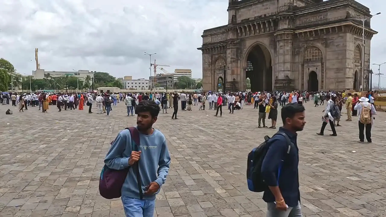 Mumbai India 20 August 2023 Tourists and locals milling around in the courtyard of the famous Gateway of India arch in Mumbai India