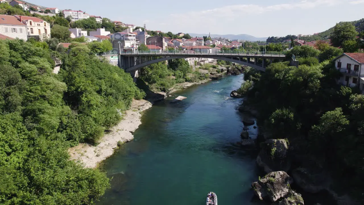 Aerial view towards Lučki most Mostar city bridge and stunning scenic blue water of Neretva river Bosnia and Herzegovina