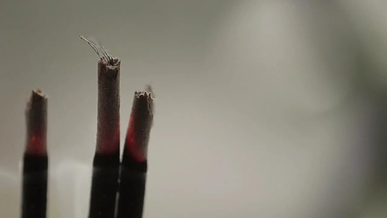 Incense sticks burning with smoke