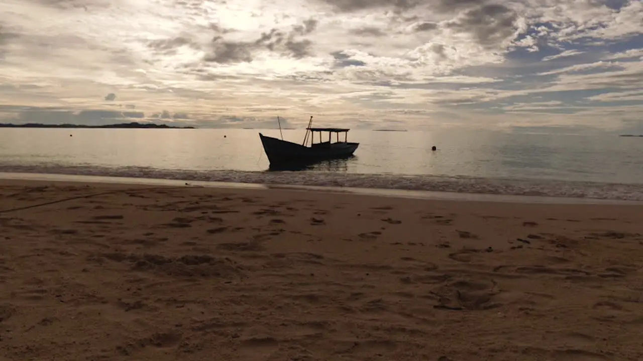 Time lapse small boat on ocean