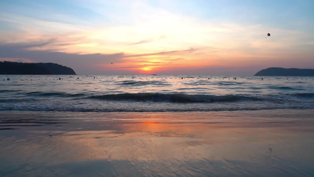 Parasailing during red sunset at Langkawi island Malaysia