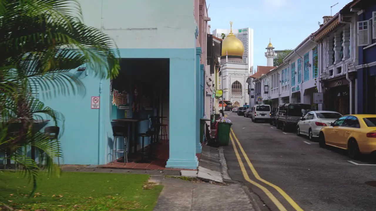 A walk across a street with the Sultan Mosque in the background Singapore