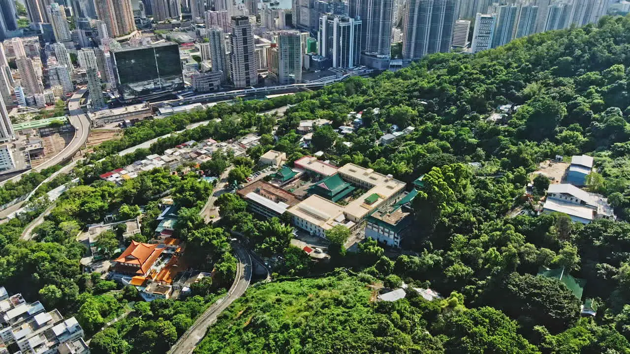 Aerial drone shot of old temple in Tsuen Wan Hong Kong cityscape