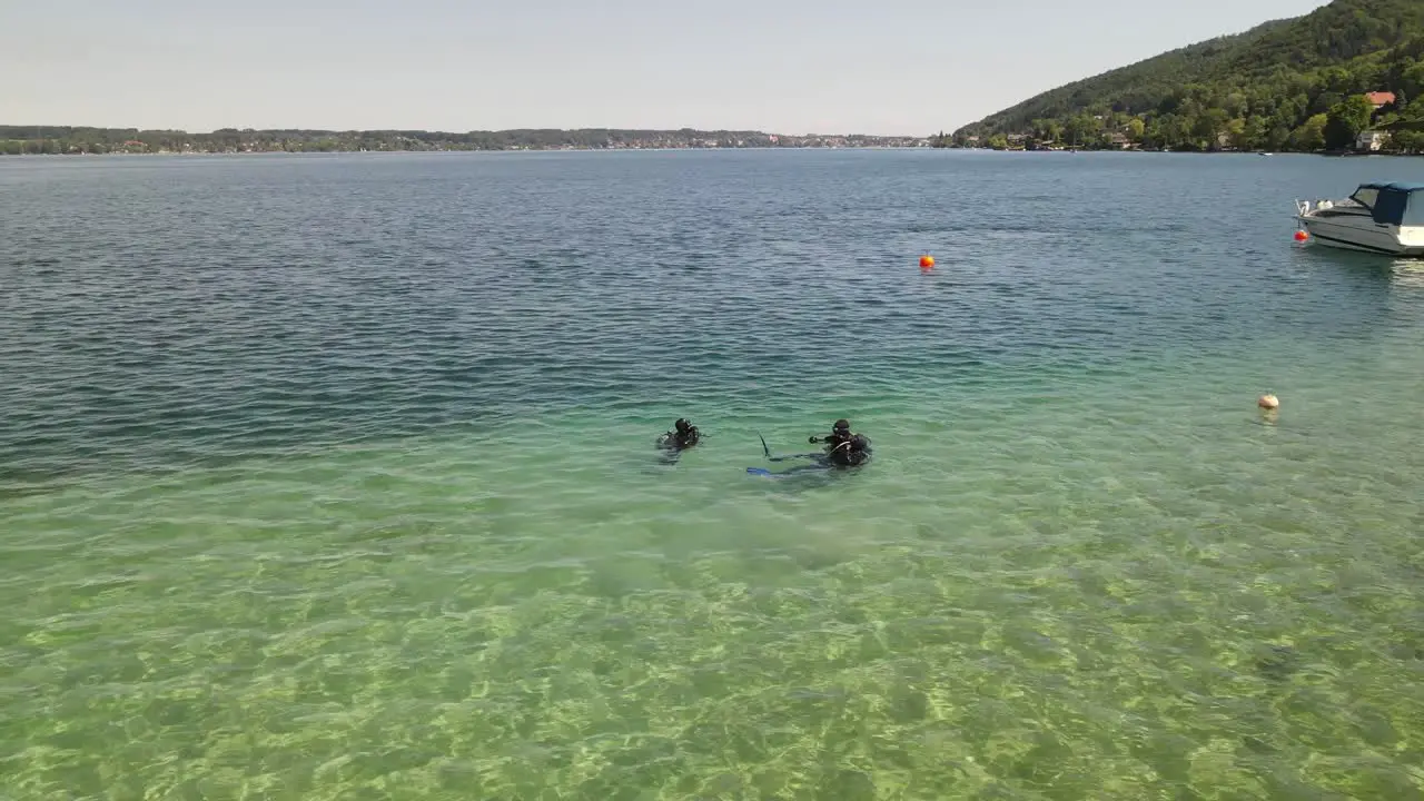 Scuba diving course teaching at shore of an lake