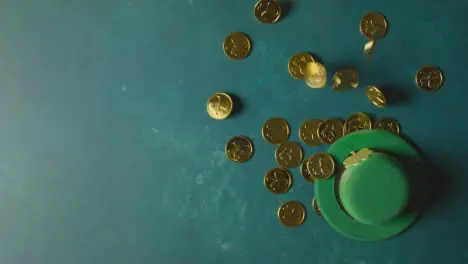 Overhead Studio Shot Of Green Leprechaun Top Hat And Piles Of Gold Coins To Celebrate St Patricks Day 3