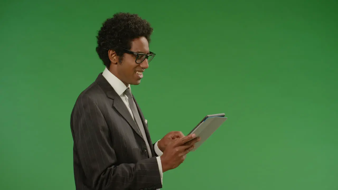 Happy Businessman Uses Tablet on Green Screen