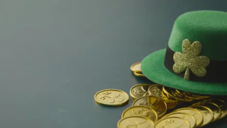 Studio Shot Of Green Leprechaun Top Hat And Piles Of Gold Coins To Celebrate St Patricks Day 2