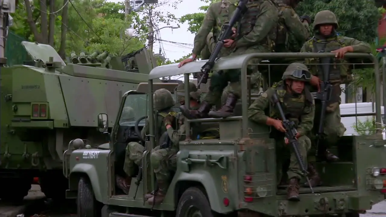 Military in armor cars supporting the police to take over a favela in Rio de Janeiro