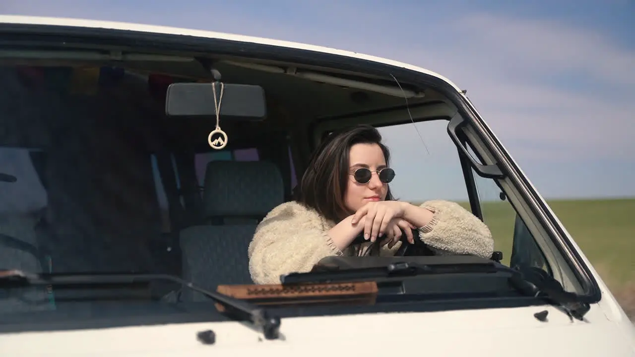 A Pretty Girl With Sunglasses At The Wheel Of A Caravan Stopped On A Lost Road In The Middle Of The Countryside 1