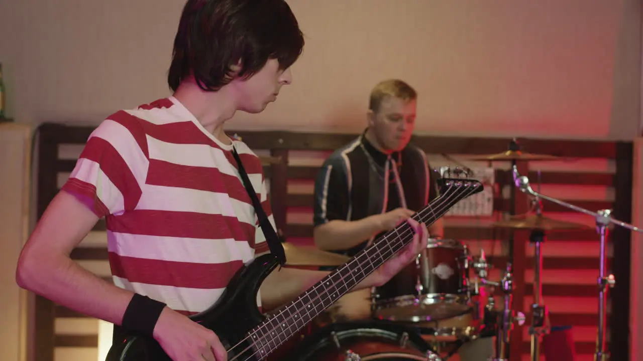 Music Band Rehearsing In Recording Studio