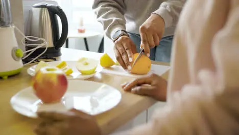 Women cutting fruits