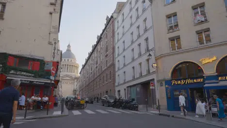 Exterior Of The Pantheon In Paris France With Bar And Restaurant In Foreground Shot in Slow Motion