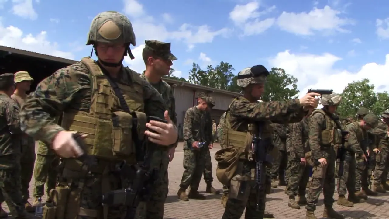 Australian And American Soldiers Practice Firing Weapons At The Firing Range