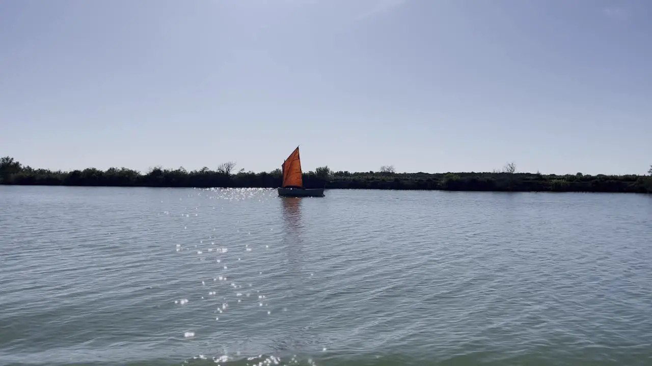 small sailboat on a wide river in France in nature