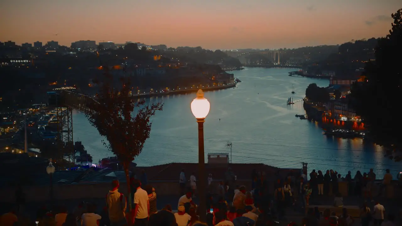 Crowd of Tourist Enjoying Beautiful Italian Sunset at Scenic Landmark at Docks