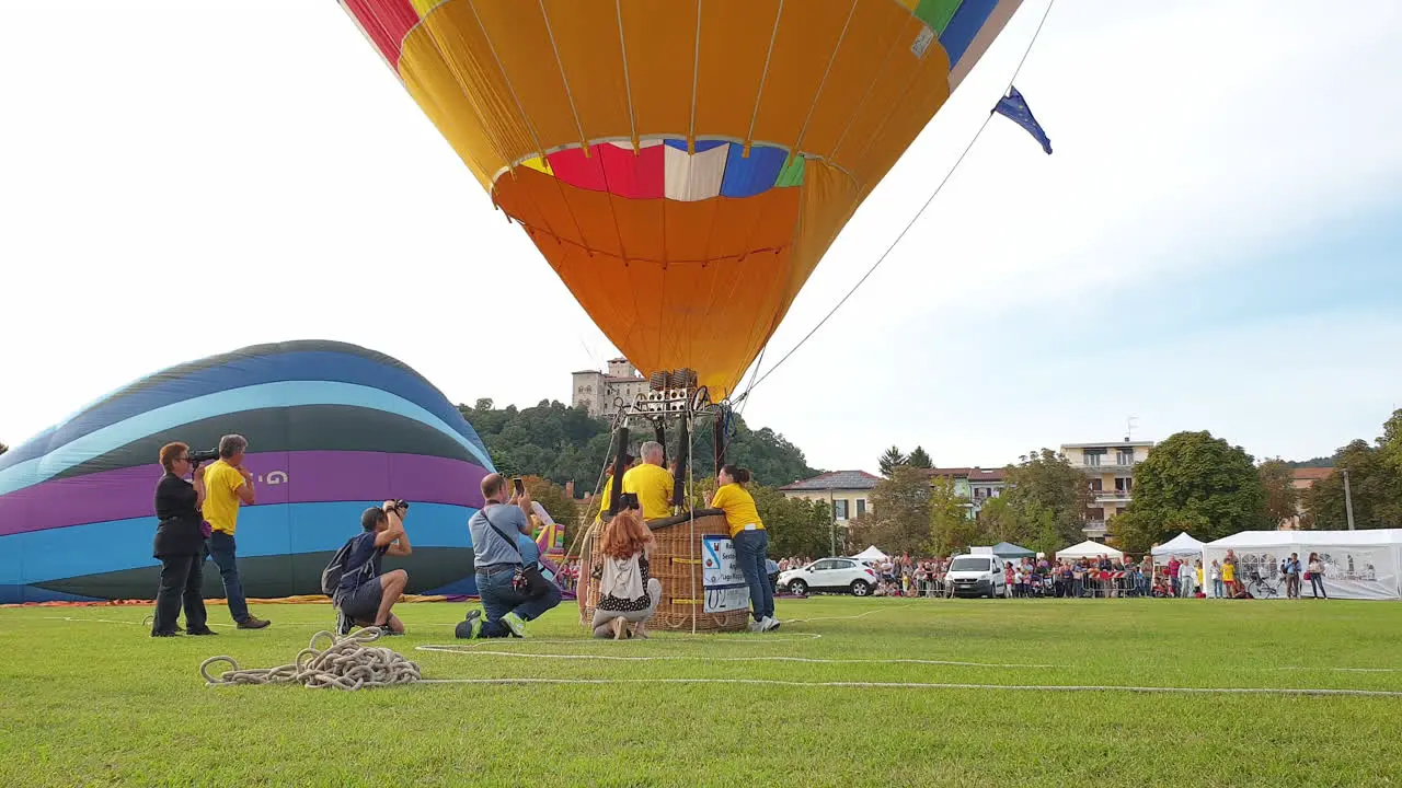 preparing hot air balloon under clear sky of italy low angle still shot