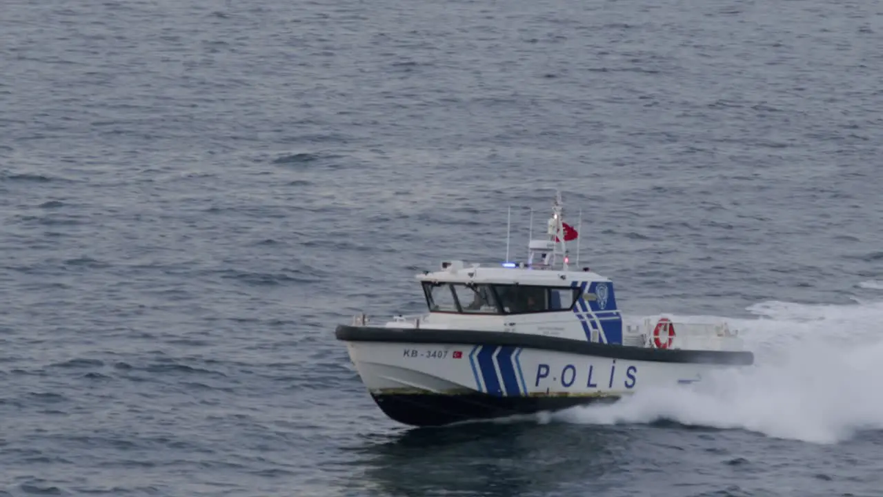 Maritime police boat coast guard advancing rapidly in the Bosphorus police officers saving people