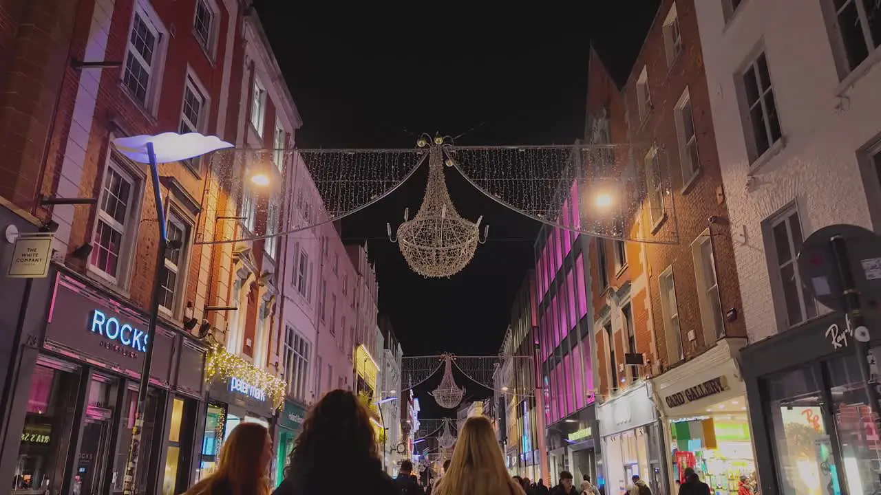 A 4K walk down Grafton St Dublin Ireland following three girls window shopping and Gards patrolling