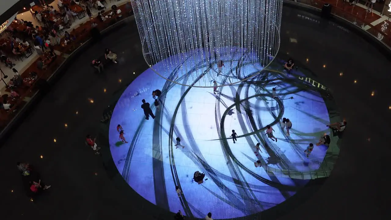 People Plays in Disco Spotlight at Mall Recreation Area High Angle View Singapore