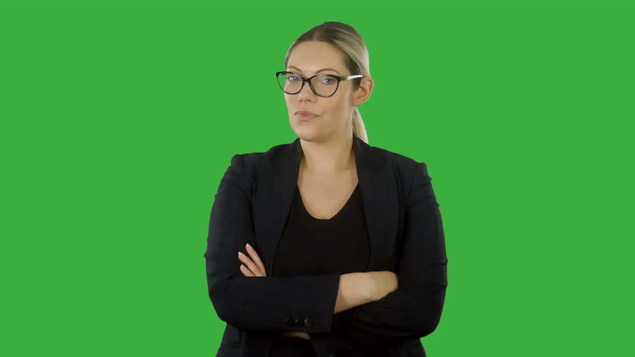 Dissatisfied woman looking into camera with arms folded