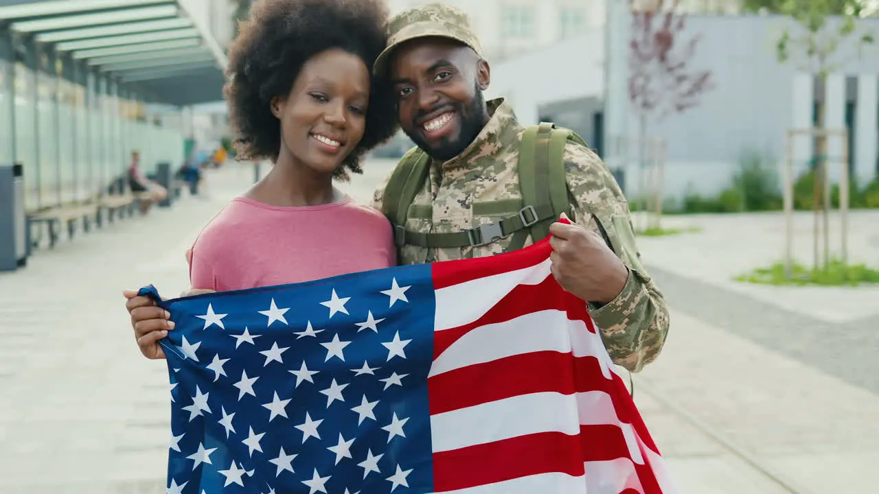 Portrait Of An Couple Hugging And Smiling Outdoors