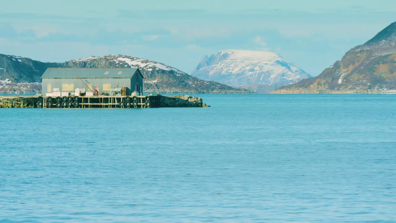 Long lens shot of a boathouse or industrial building near Tromvik Norway