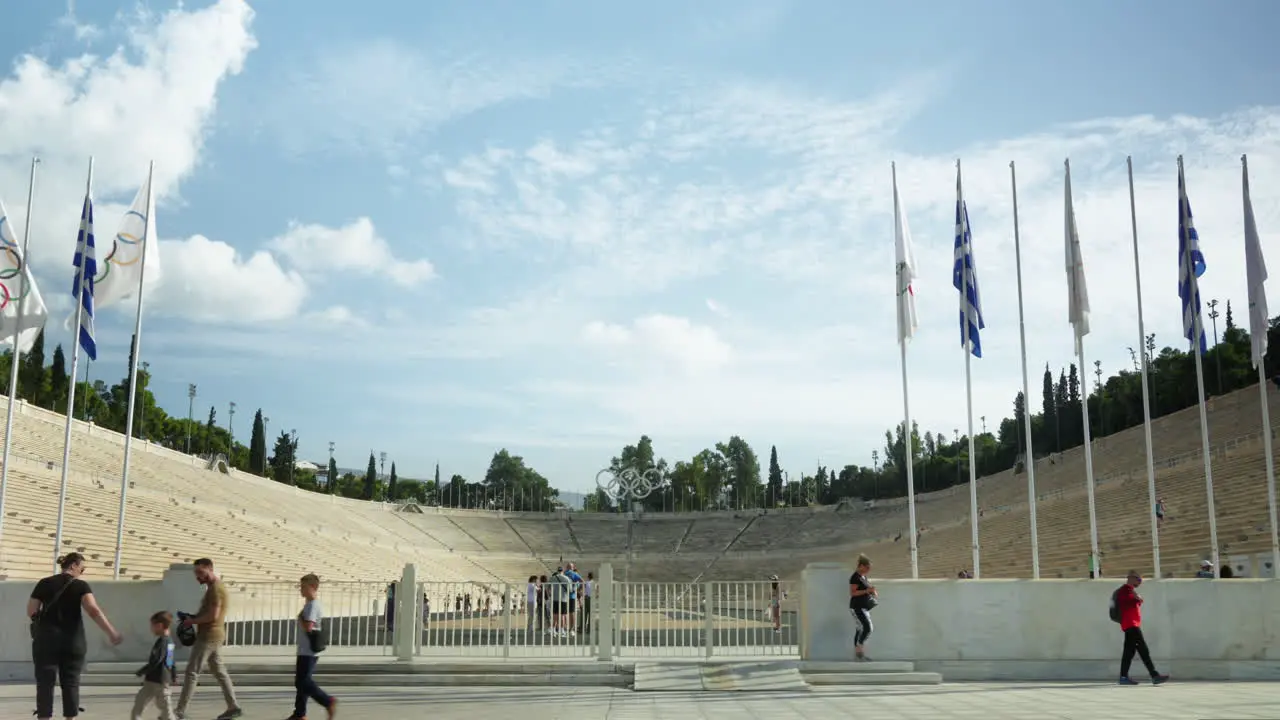 Tourists walking by the historic Panathenaic Stadium in Athens