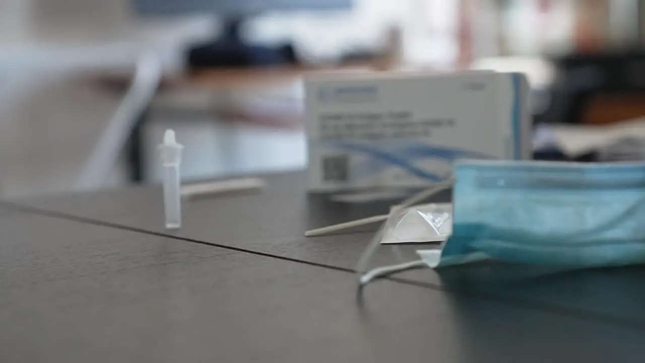 Cinematic shot of a coronavirus self test kit on the table