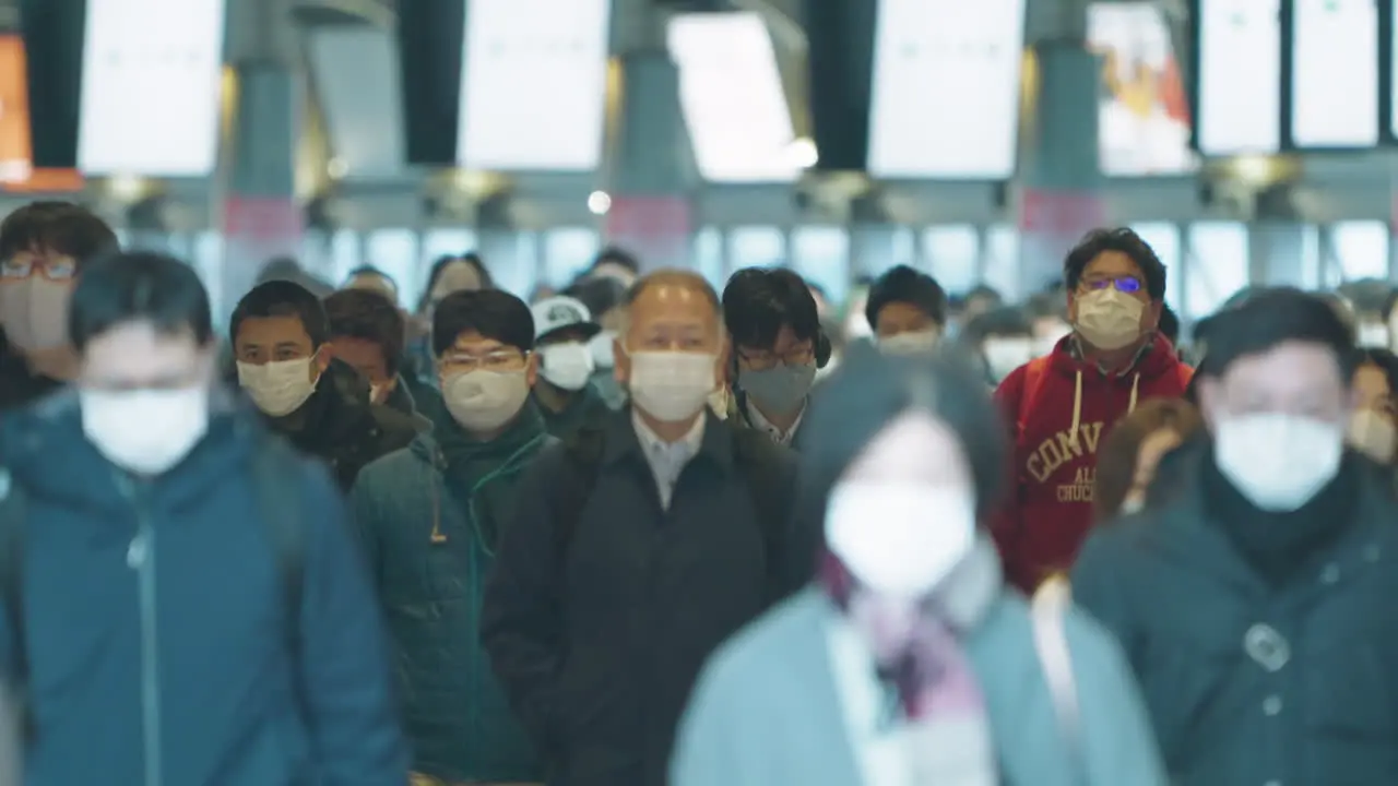 Scene At Shinagawa Station During Rush Hour With Crowd Of People In Face Mask As Safety Measure For COVID-19 Outbreak In Tokyo Japan