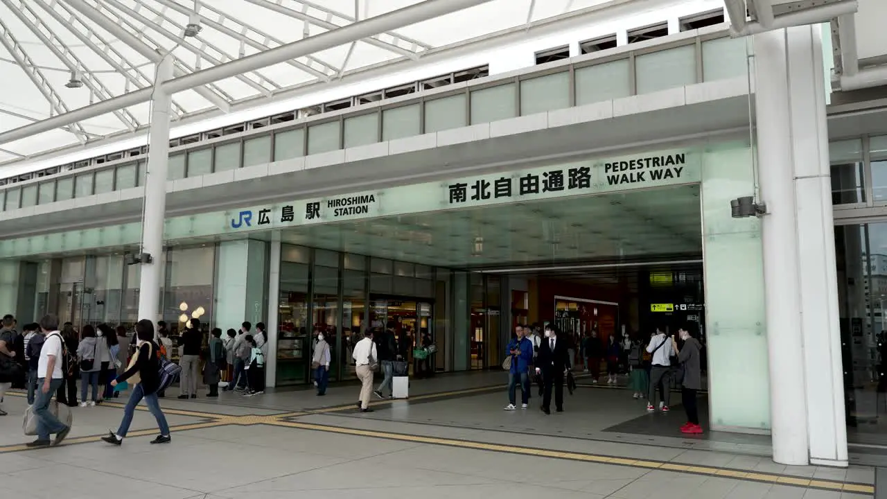 Tourists Commuters And Travellers Walking Though JR Hiroshima Pedestrian Walkway