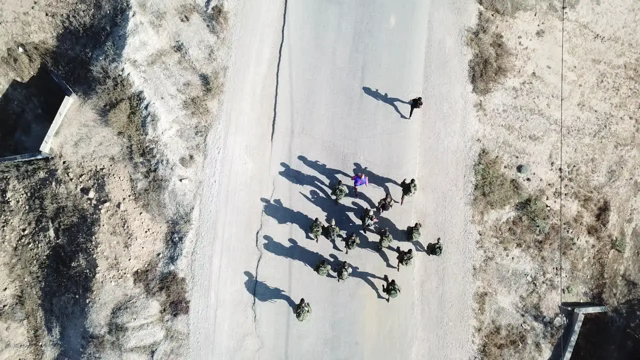 Drone top shot IDF Soldier Troops running hand in hand during physical training