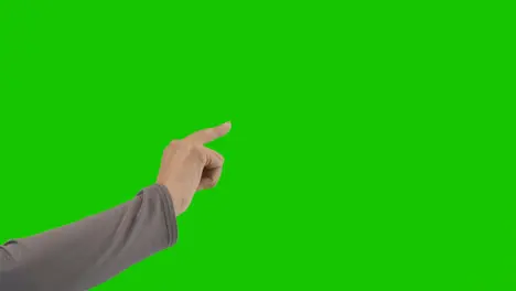 Studio Close Up Shot Of Woman Pretending To Press Buttons Against Green Screen