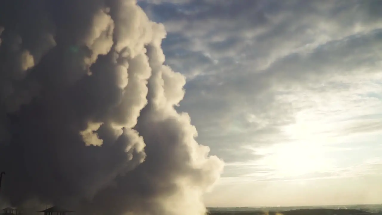 Close up shot of flowing industrial smoke on the sunset