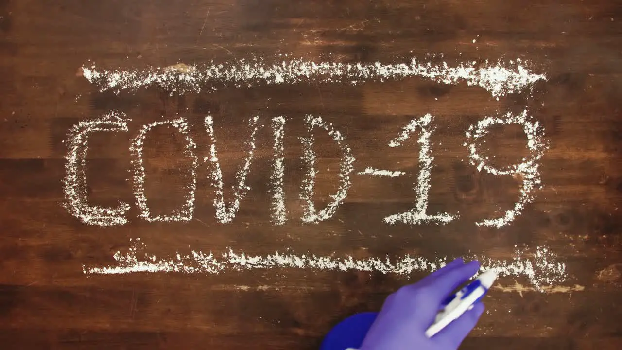 Covid-19 sign sprayed with disinfectant to eradicate virus