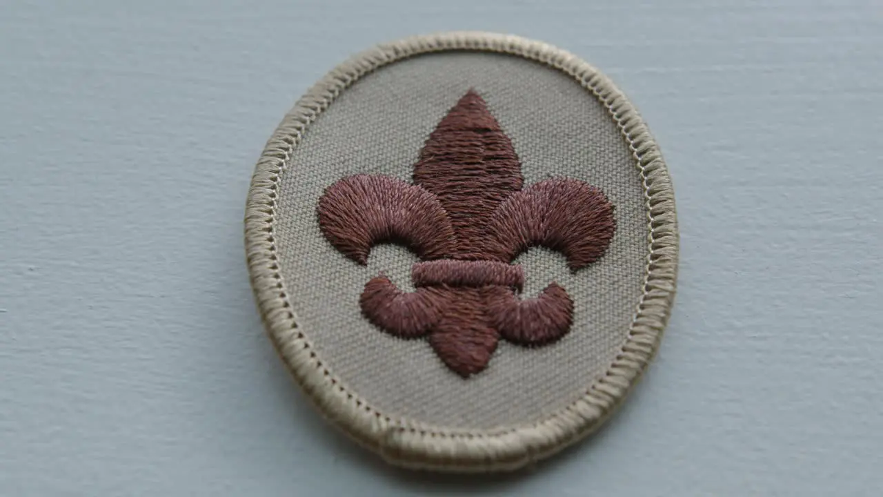 Close Up Pan Right of a Boy Scout Arm Patch