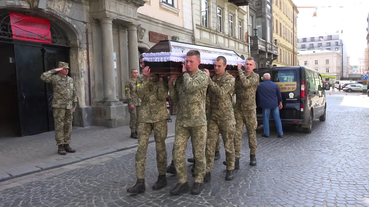 Ukrainian Army Soldiers Carry The Coffin Of A Fallen Soldier In A Funeral Procession On The Streets Of Lviv Ukraine