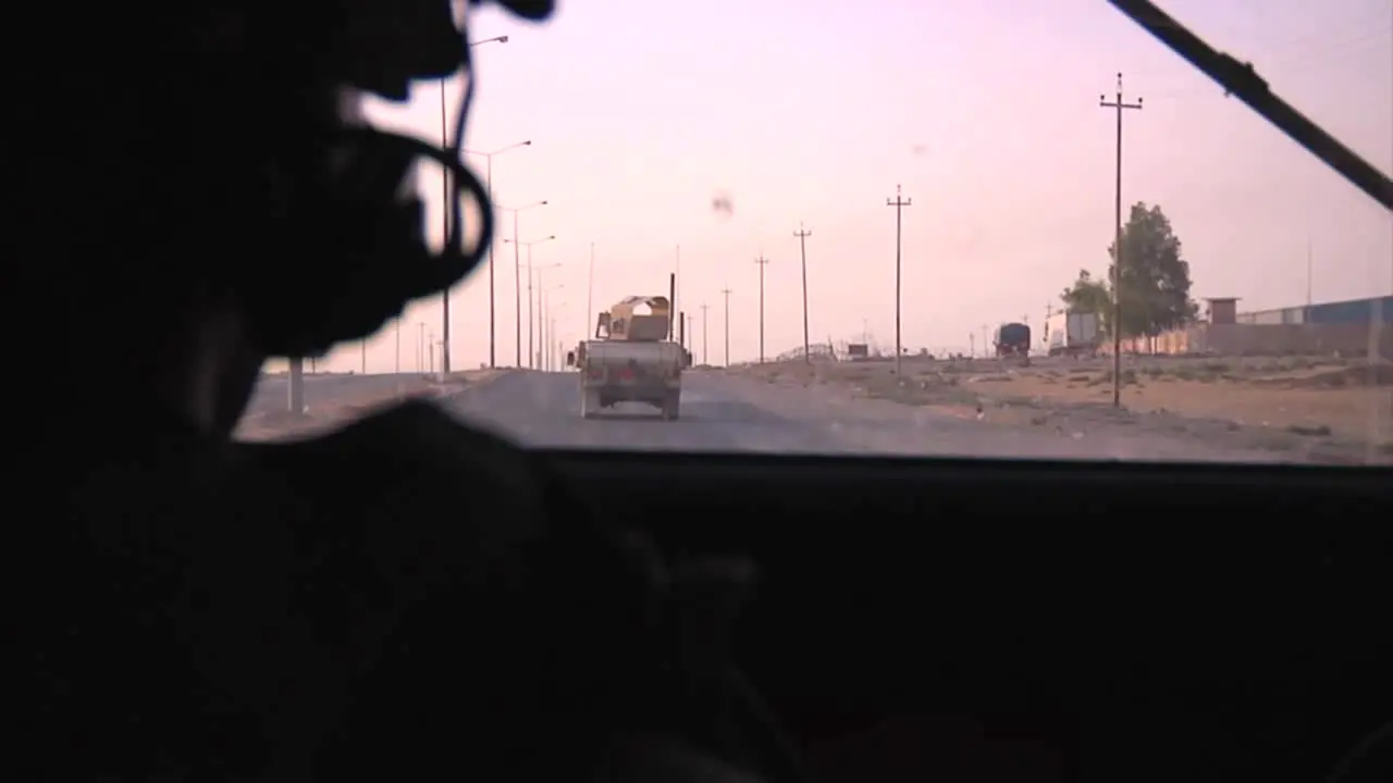 Pov Shot From An Armored Humvee Of Us Soldiers In A Convoy On A Highway In Iraq