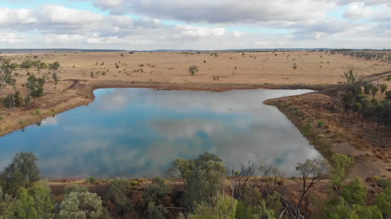 Overview drone shot of a damlake in the outback in Australia