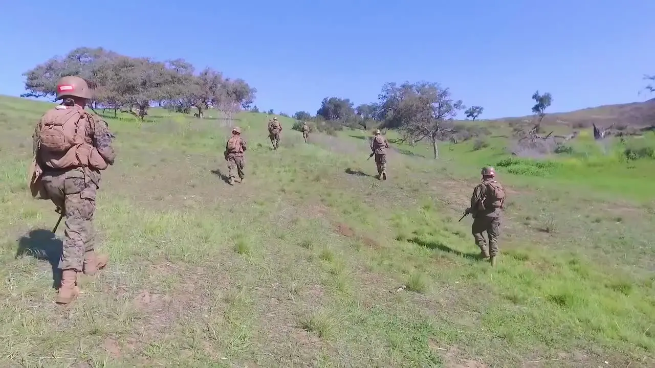 Marines Walk Across An Open Field During Final Army Infantry Exercises Basic Training