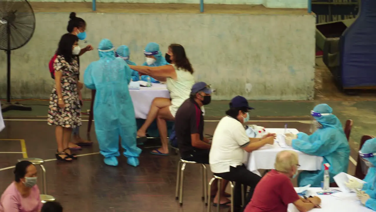 High angle gimbal shot of vaccination of foreigners