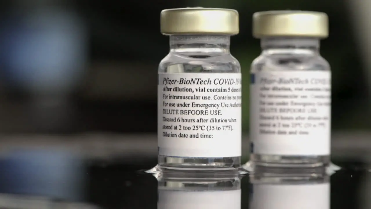 Two Vials Of Pfizer-BioNTech Covid-19 Vaccine With Directions For Use