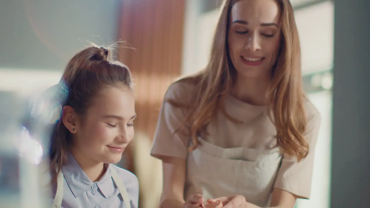 Mother and daughter baking together in the kitchen