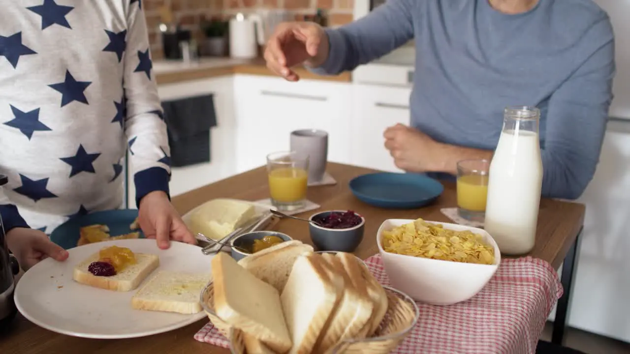 Video of father and son eating breakfast at the morning