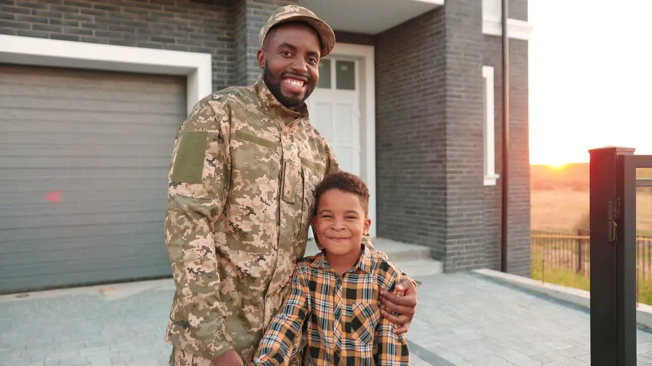 Portrait A Happy American Soldier With His Small Son