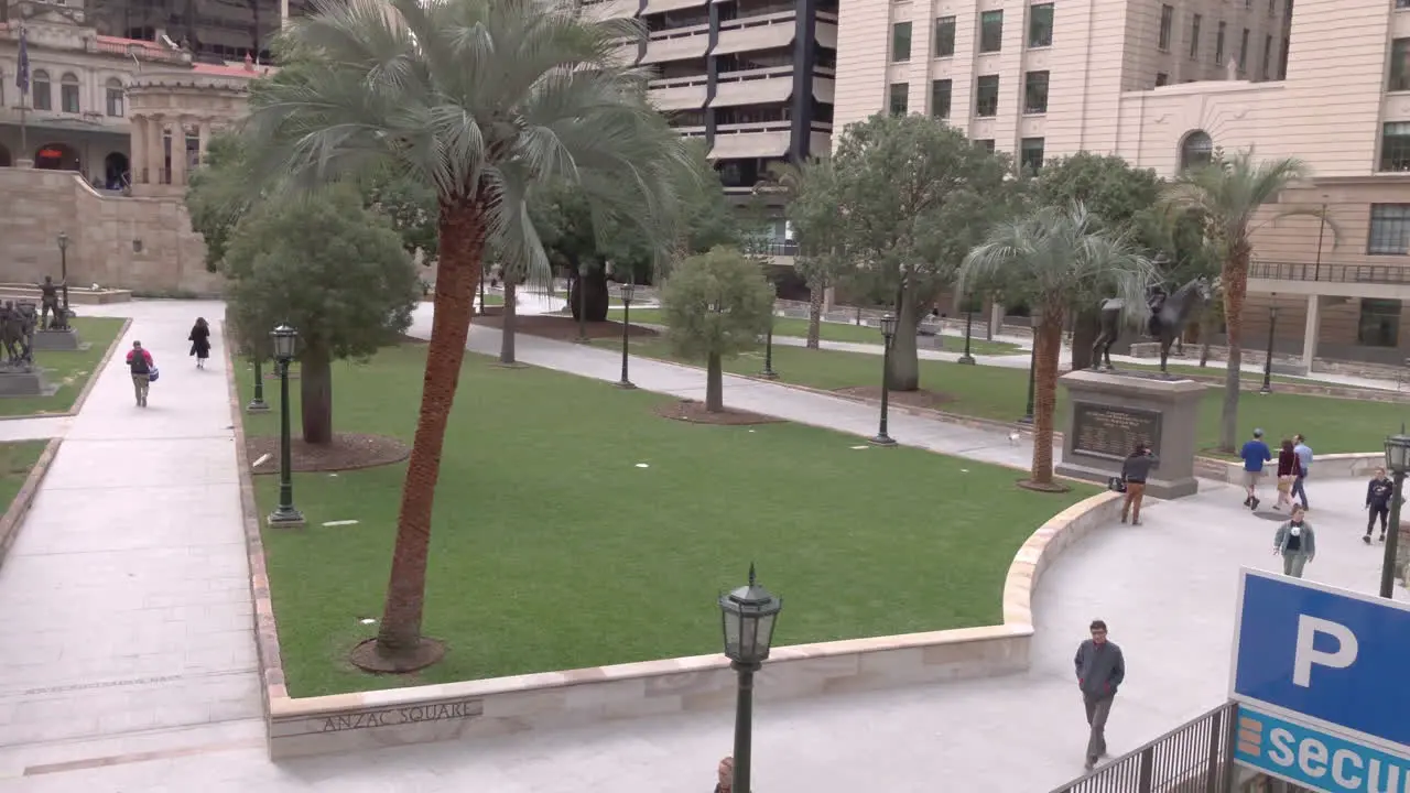 Anzac Square Brisbane City view of gardens with commuters walking by