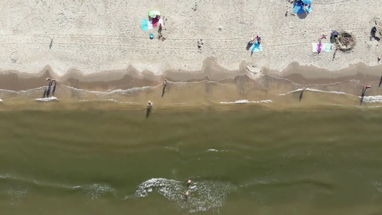 Wijk aan Zee shoreline with people enjoying the beach in North Holland the Netherlands Rocket Bird's eye view Aerial shot